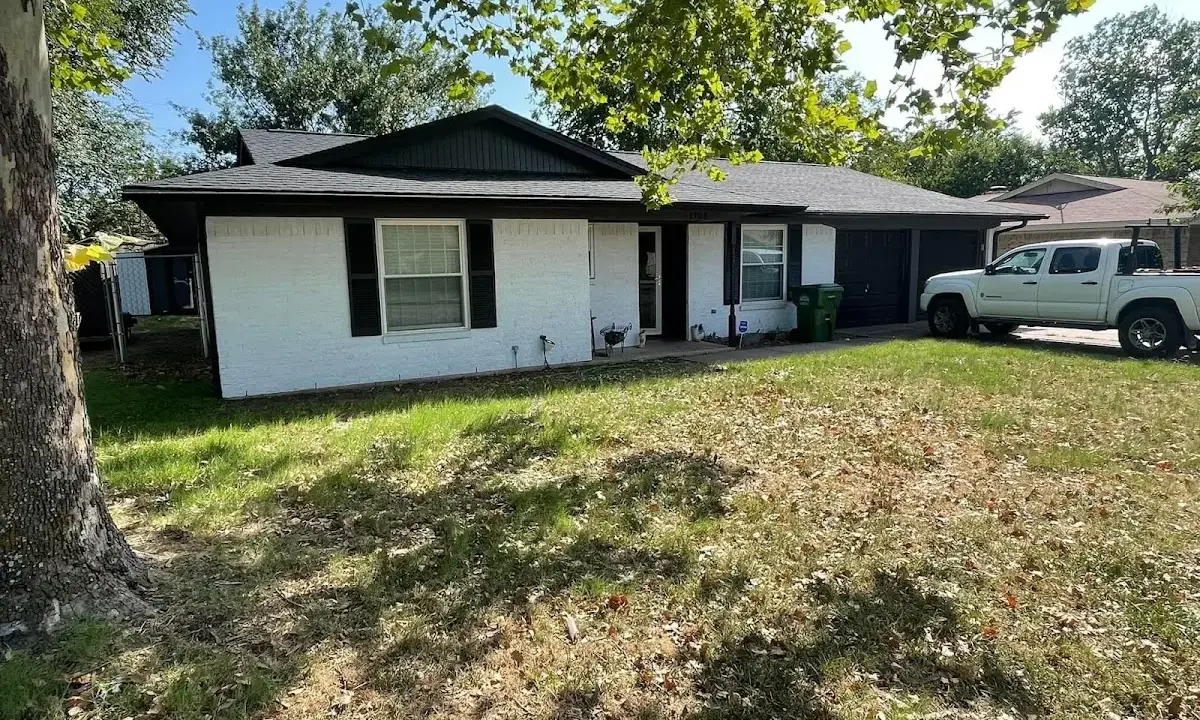 Professional roofing crew working on a residential roof in Berlin